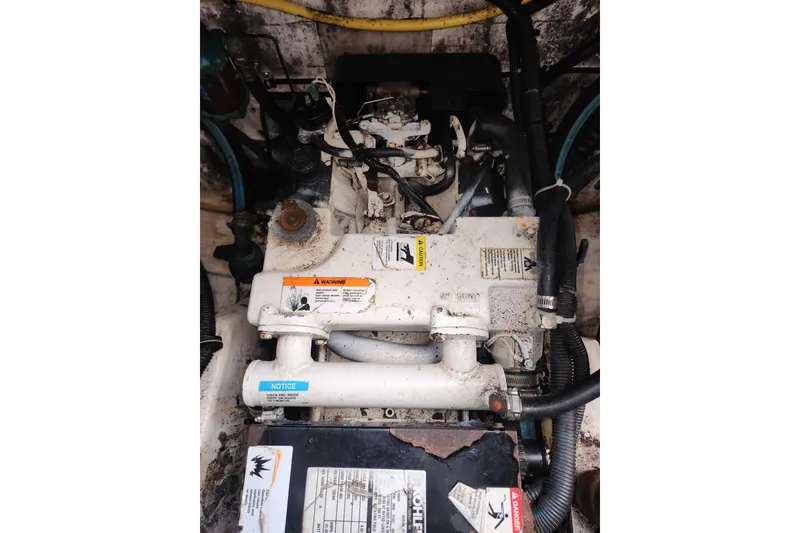 Slide: The Image of Engine compartment of a 2003 Tiara Yachts 3100 Open LE, showing mechanical components and wiring. - 12