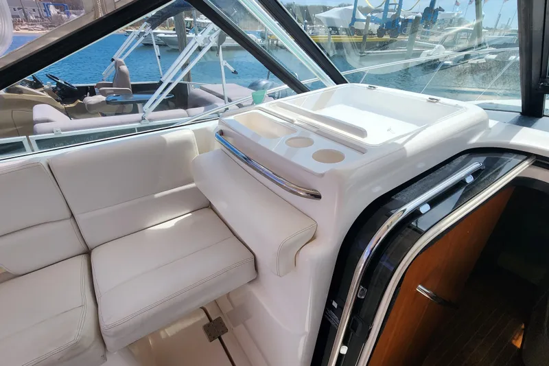 Slide: The Image of Interior of 2003 Tiara Yachts 3100 Open LE, featuring seating and helm station. - 17
