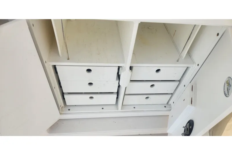 Slide: The Image of Storage compartment with drawers on a 2003 Tiara Yachts 3100 Open LE. - 20