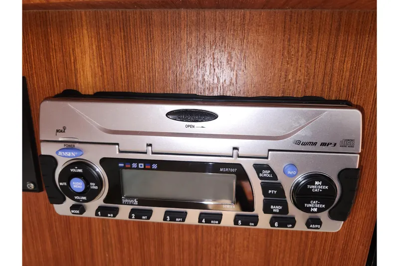 Slide: The Image of Jensen stereo system in 2003 Tiara Yachts 3100 Open LE, featuring WMA and MP3 playback. - 27