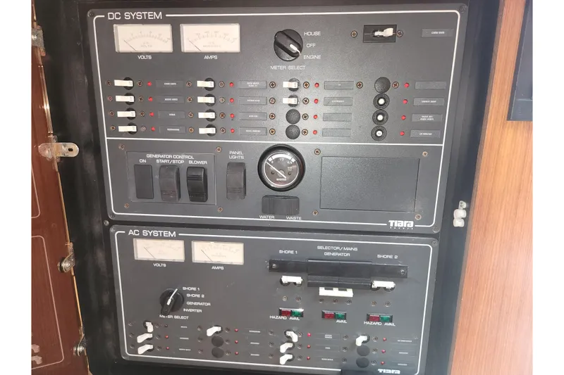 Slide: The Image of Electrical control panel of a 2003 Tiara Yachts 3100 Open LE, featuring DC and AC systems. - 30