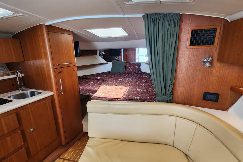 Slide: The Image of Interior of 2003 Tiara Yachts 3100 Open LE with cozy cabin and kitchenette. - 32
