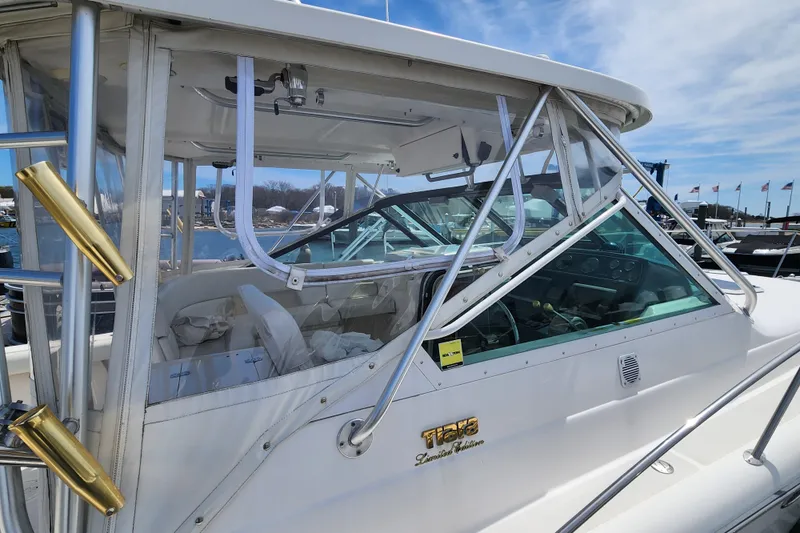 Slide: The Image of 2003 Tiara Yachts 3100 Open LE boat with enclosed cockpit and clear windows. - 39