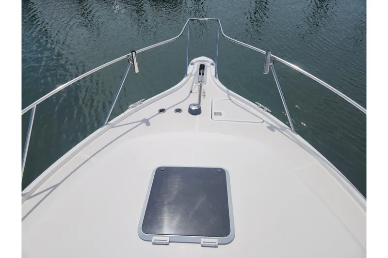 Slide: The Image of 2003 Tiara Yachts 3100 Open LE bow view on water. - 55