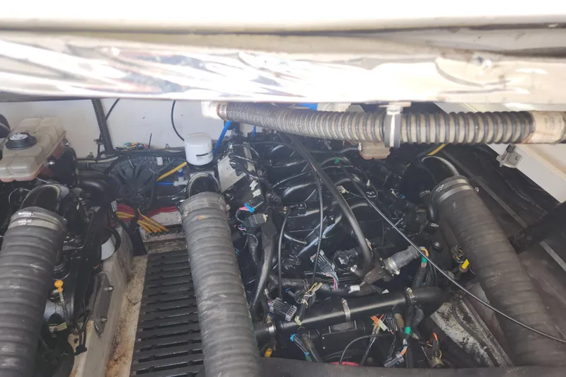 Slide: The Image of Engine compartment of a 2003 Tiara Yachts 3100 Open LE, showcasing mechanical components. - 9