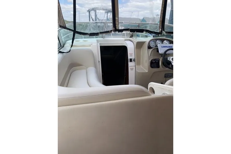 Slide: The Image of Interior view of a 2002 Chaparral Signature 260 boat cockpit with steering and seating. - 13