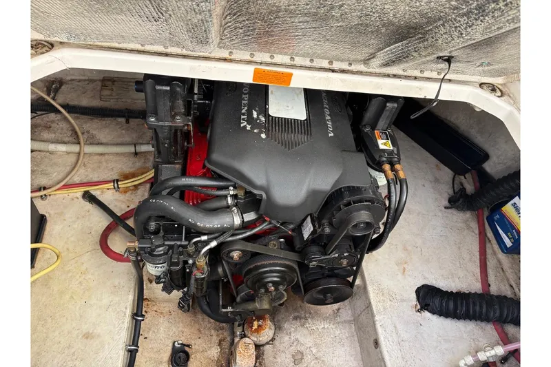 Slide: The Image of Engine compartment of a 2002 Chaparral Signature 260 boat, featuring a Volvo Penta engine. - 6