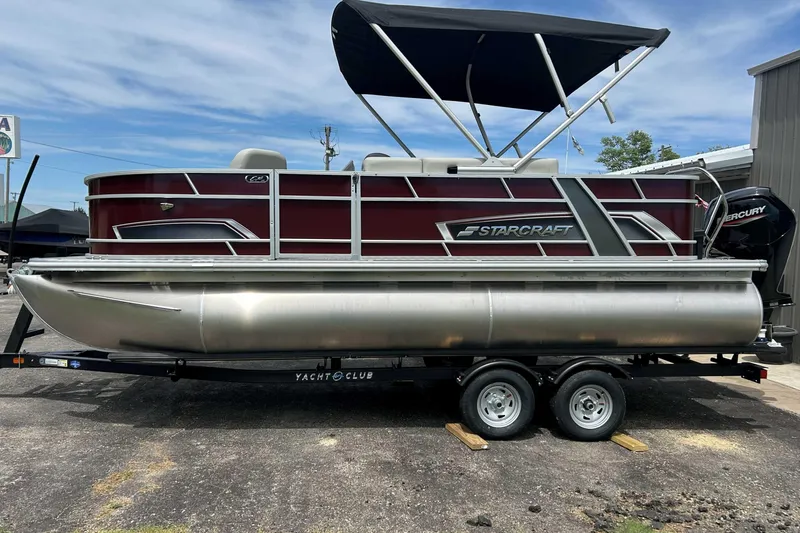 The Image of 2026 Starcraft EX 20 F pontoon boat with canopy on trailer, side view. - 0