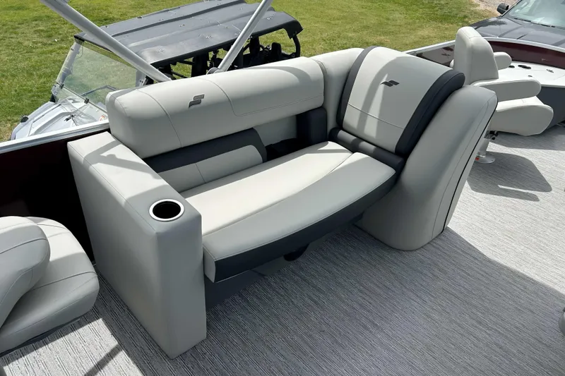 Slide: The Image of Luxurious seating on 2026 Starcraft EX 20 F boat with cup holder and modern design. - 2