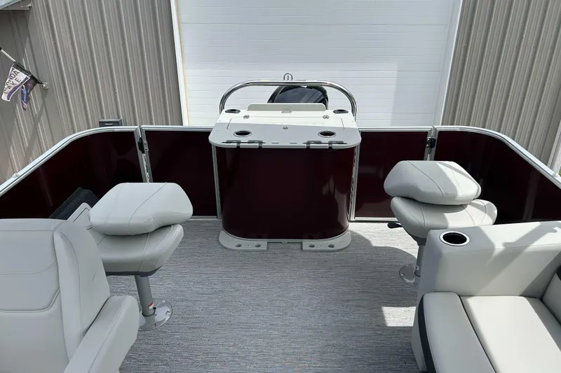 Slide: The Image of 2026 Starcraft EX 20 F pontoon boat interior with seating and helm station. - 5
