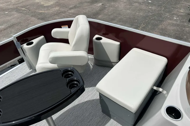 Slide: The Image of 2026 Starcraft EX 20 F boat interior with white seating and cup holders. - 8