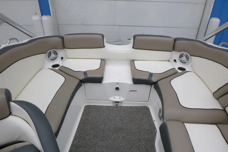 Slide: The Image of Interior seating of a 2011 Yamaha Boats 242 Limited S, featuring cushioned seats and speakers. - 11
