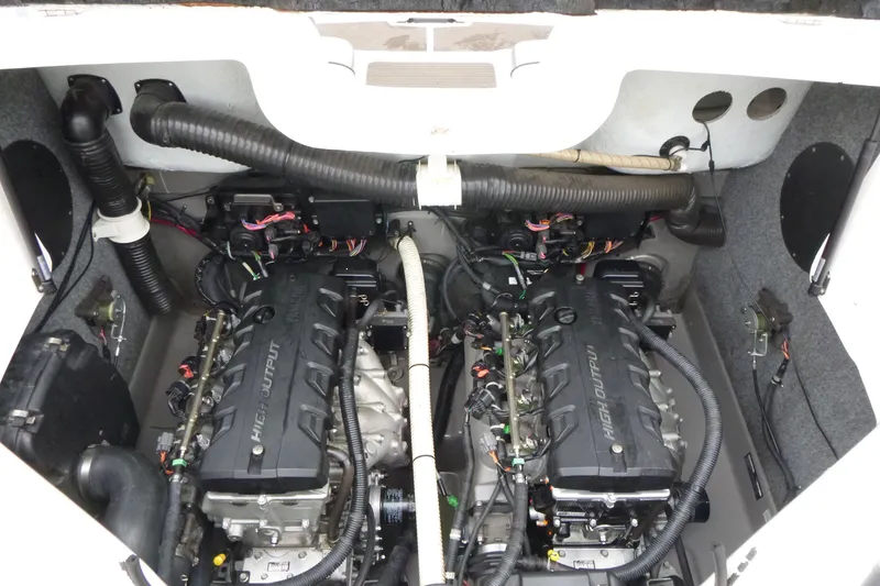 Slide: The Image of Engine compartment of a 2011 Yamaha Boats 242 Limited S, featuring dual high-output engines. - 12