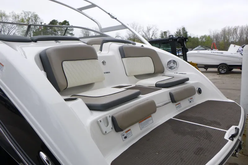 Slide: The Image of 2011 Yamaha Boats 242 Limited S swim platform with cushioned seating and sleek design. - 5