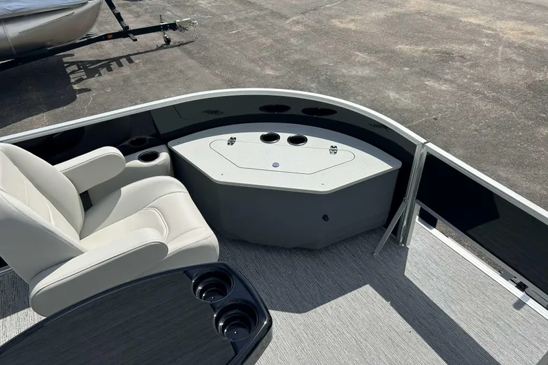 Slide: The Image of 2026 Starcraft EX 22 FD boat interior with seating and cup holders. - 3