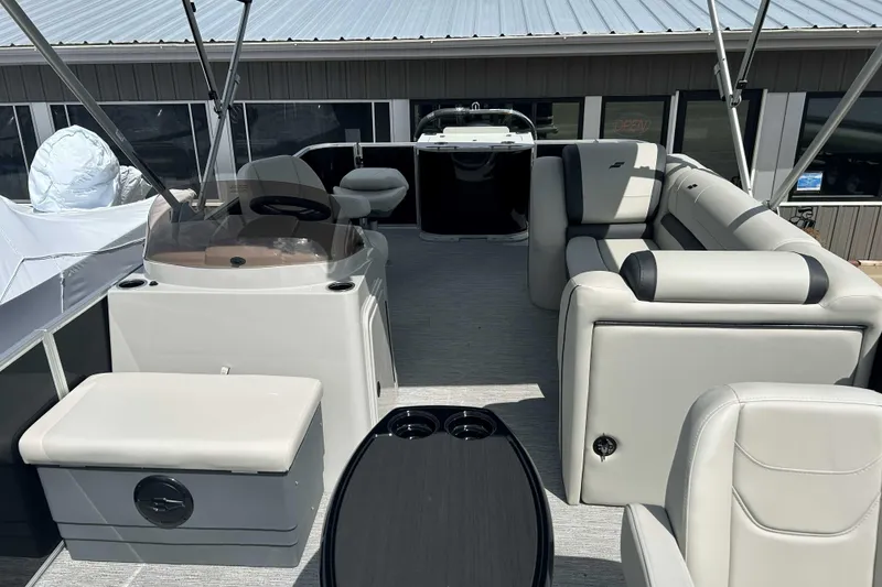 Slide: The Image of 2026 Starcraft EX 22 FD pontoon boat interior with modern seating and helm. - 7
