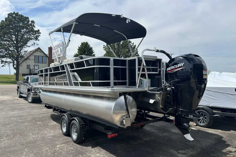 Slide: The Image of 2026 Starcraft EX 22 FD pontoon boat with Mercury outboard motor on trailer. - 8