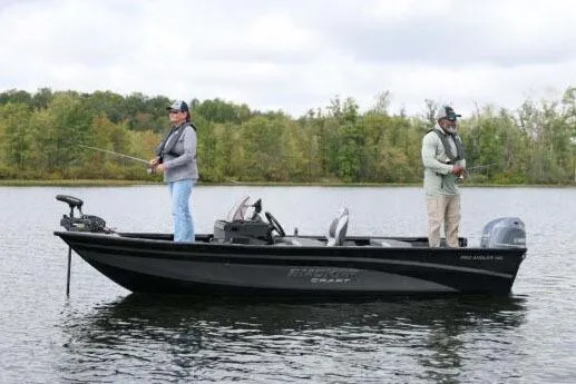 Slide: The Image of Manufacturer Provided Image: 2026 Smoker Craft Pro Angler 165 SC boat with two people fishing on a lake. - 24