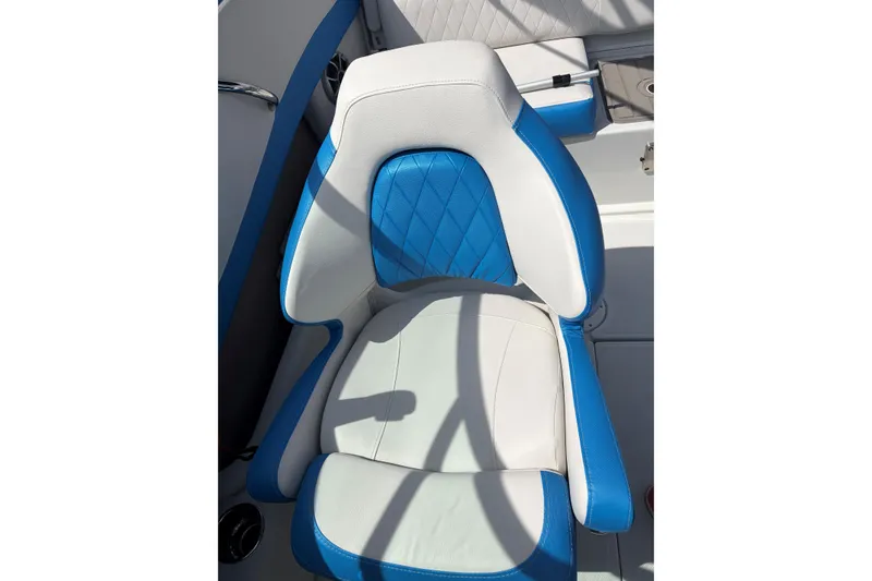 Slide: The Image of Blue and white seat on 2025 Crownline 220 SS boat, featuring modern design. - 12
