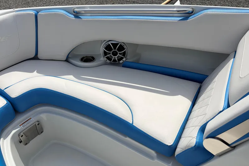 Slide: The Image of 2025 Crownline 220 SS boat interior with white and blue cushioned seating. - 18