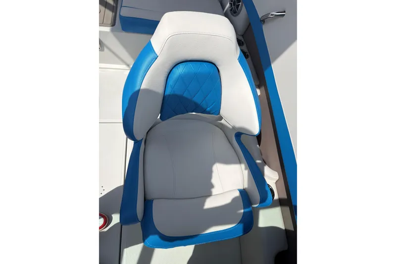 Slide: The Image of 2025 Crownline 220 SS boat seat with blue and white upholstery, featuring a modern design. - 19