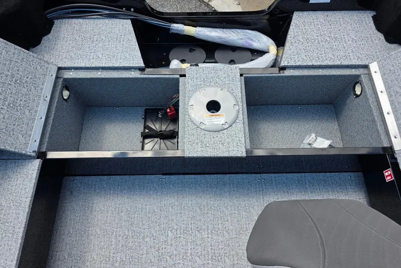 Slide: The Image of 2026 Smoker Craft Pro Angler 165 SC boat interior storage compartments and seating area. - 21