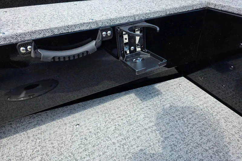Slide: The Image of 2026 Smoker Craft Pro Angler 165 SC boat interior with cup holder and handle. - 22