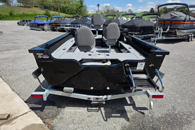 Slide: The Image of 2026 Smoker Craft Pro Angler 165 SC boat on trailer, rear view in outdoor setting. - 7