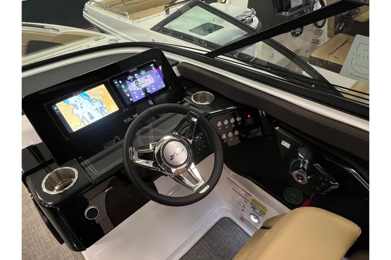 Slide: The Image of Interior view of 2025 Sea Ray SLX 260 with modern dashboard. - 10