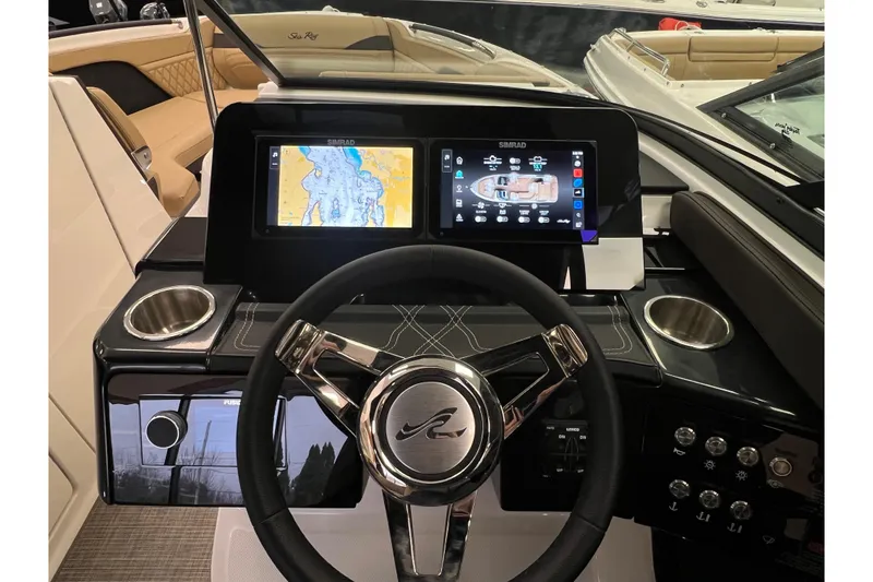 Slide: The Image of Interior view of 2025 Sea Ray SLX 260 helm with navigation system. - 11