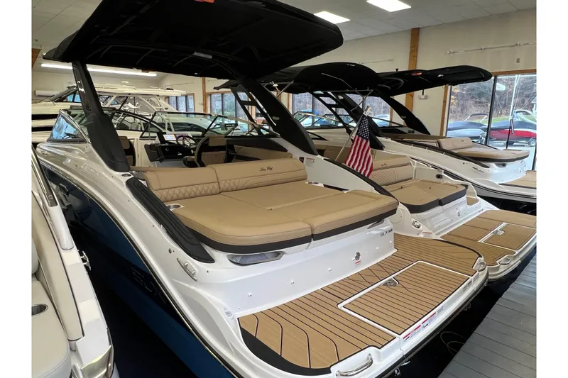 Slide: The Image of 2025 Sea Ray SLX 260 boats in showroom. - 4