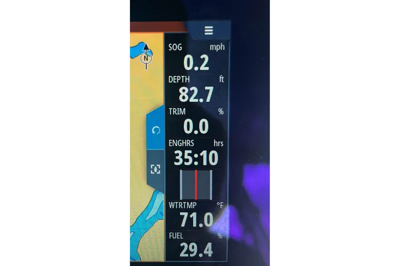 Slide: The Image of Display screen of 2023 Premier Sunsation showing speed, depth, engine hours, and fuel levels. - 8