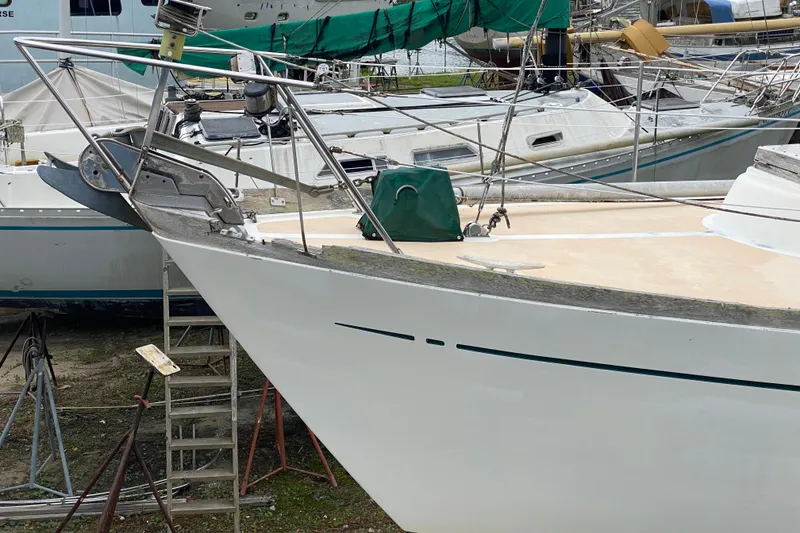 Slide: The Image of Sailboat on dry dock, Fuji 40 model, 1979, with visible deck and bow details. - 10