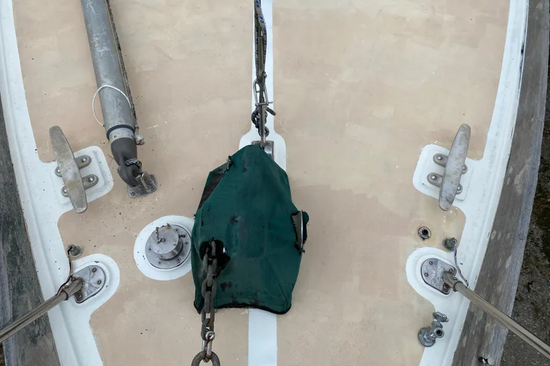 Slide: The Image of Bow of 1979 Fuji 40 sailboat with anchor chain and deck fittings. - 22