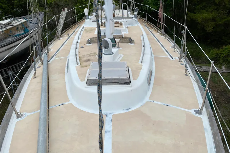 Slide: The Image of Deck view of a 1979 Fuji 40 sailboat, showcasing clean lines and rigging details. - 23