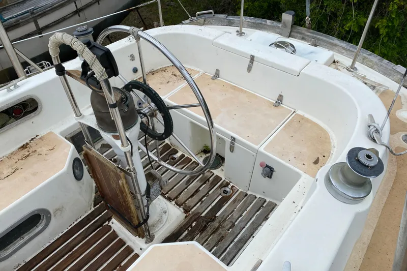Slide: The Image of Cockpit of a 1979 Fuji 40 sailboat with steering wheel and winches. - 32