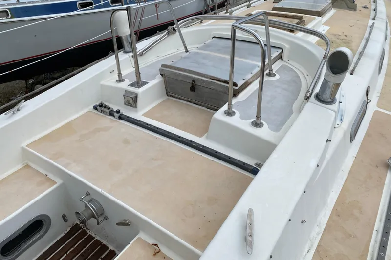 Slide: The Image of Deck of a 1979 Fuji 40 sailboat, featuring clean lines and stainless steel fittings. - 36