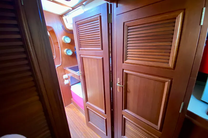 Slide: The Image of Interior of a 1979 Fuji 40 sailboat with wooden doors and nautical instruments. - 47
