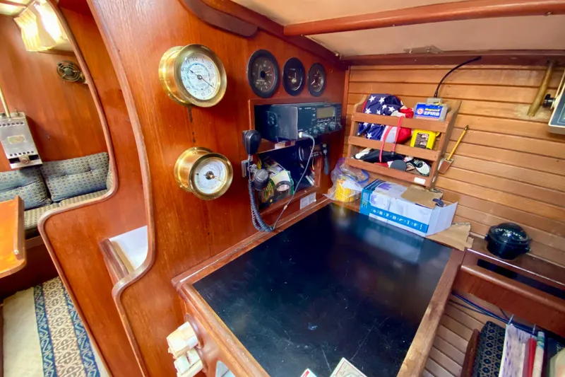 Slide: The Image of Vintage 1979 Fuji 40 yacht interior with navigation equipment and wooden paneling. - 49