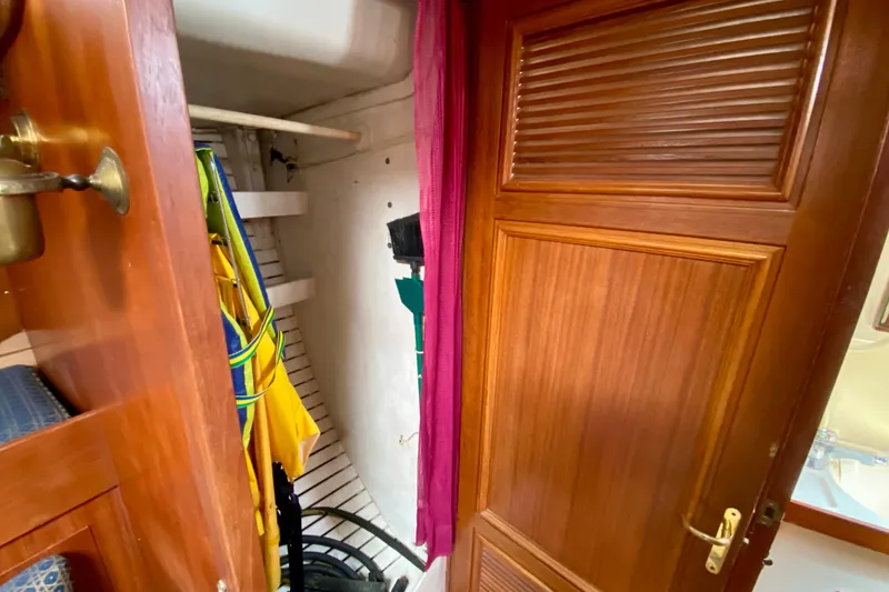 Slide: The Image of Wooden closet interior with colorful jackets, Fuji 40 model, 1979. - 54