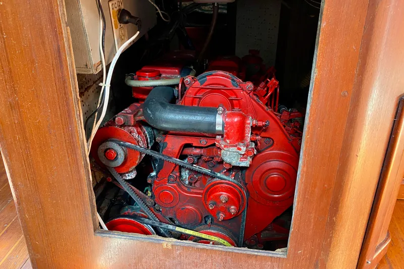 Slide: The Image of Red engine inside a wooden compartment, Fuji 40 model, 1979. - 57