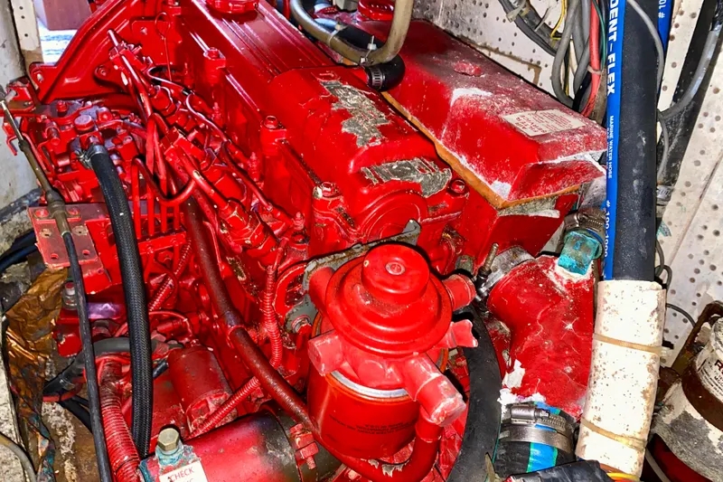 Slide: The Image of Red engine from a 1979 Fuji 40, featuring intricate hoses and components. - 61