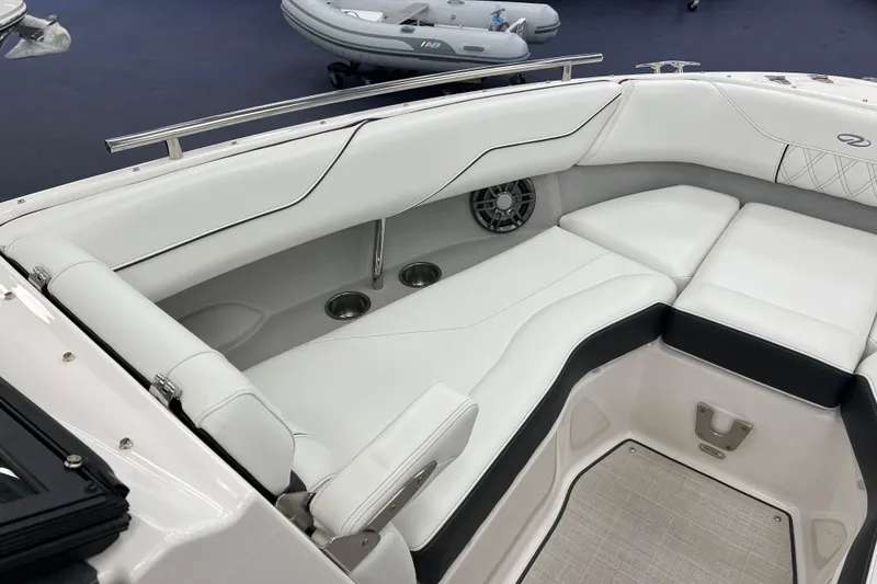 Slide: The Image of Luxurious interior of 2025 Regal LS4 boat with white seating and cup holders. - 12