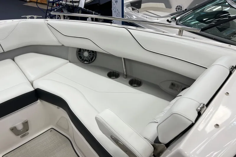Slide: The Image of Luxurious interior of 2025 Regal LS4 boat with white seating and cup holders. - 13