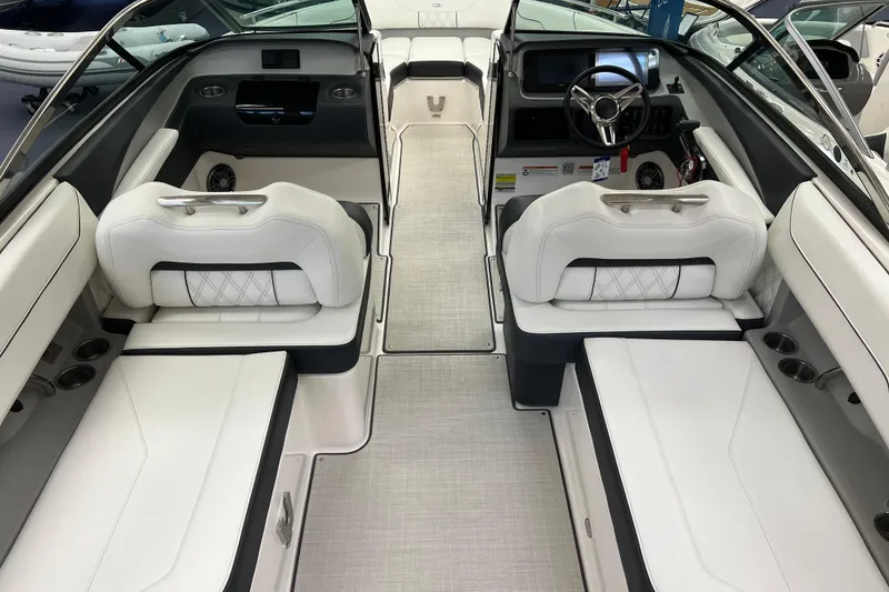 Slide: The Image of 2025 Regal LS4 boat interior with white seating and modern dashboard design. - 3