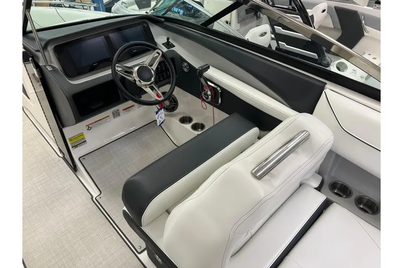 Slide: The Image of 2025 Regal LS4 boat interior with steering wheel and modern dashboard. - 6