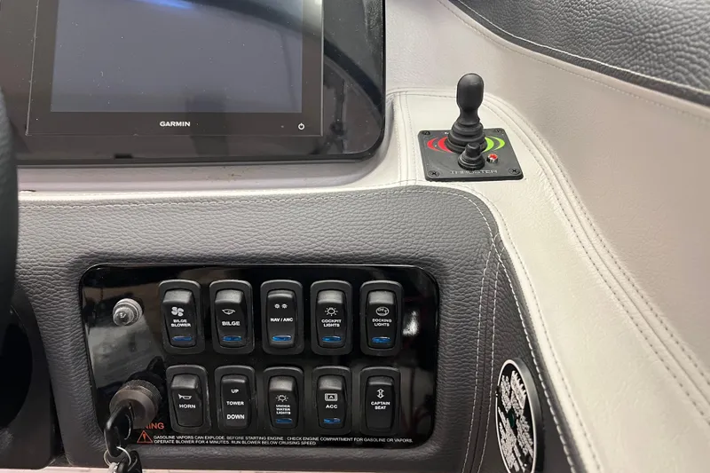 Slide: The Image of Control panel of 2025 Regal LS4 boat with Garmin display and thruster joystick. - 8