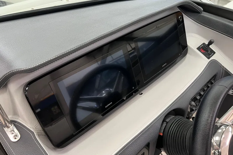 Slide: The Image of 2025 Regal LS4 dashboard featuring dual Garmin displays and modern controls. - 9