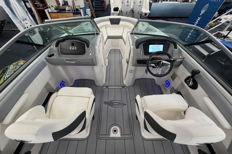 Slide: The Image of Interior view of 2025 Chaparral 21 SSi OB boat, featuring modern dashboard and seating. - 10