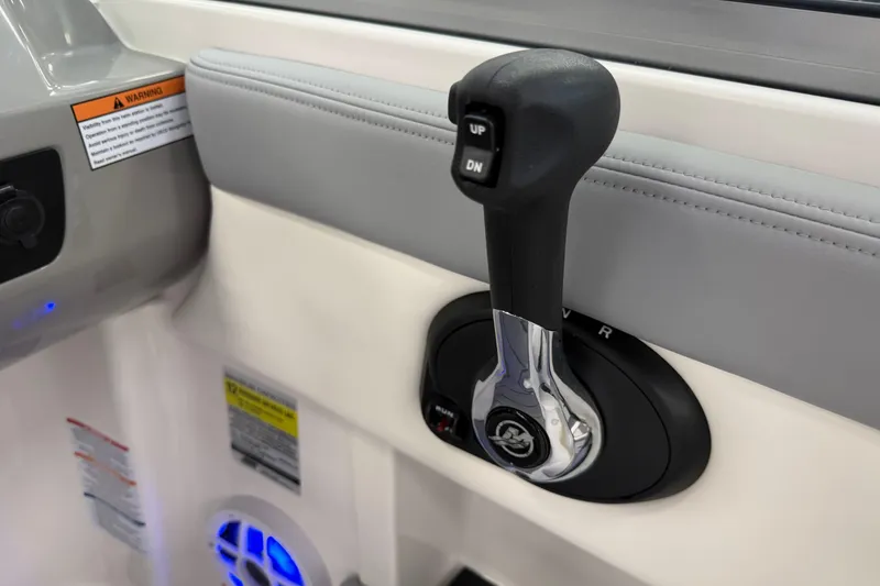 Slide: The Image of Throttle control lever on 2025 Chaparral 21 SSi OB boat interior. - 12